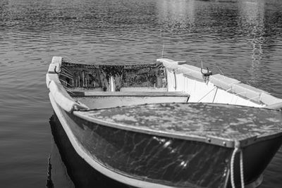 Boat moored in lake