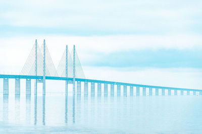 Bridge over sea against sky