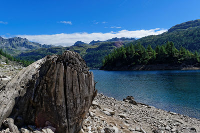 Scenic view of mountains against blue sky