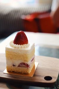 Close-up of strawberry shortcake served on table