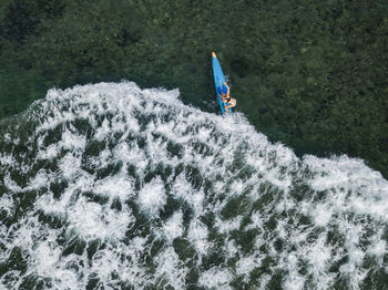 Young woman on stand up paddling board