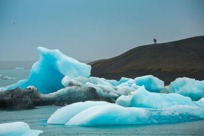 Scenic view of frozen sea against sky