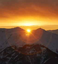 Scenic view of landscape against sky during sunset