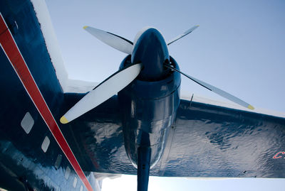 Low angle view of airplane against clear sky