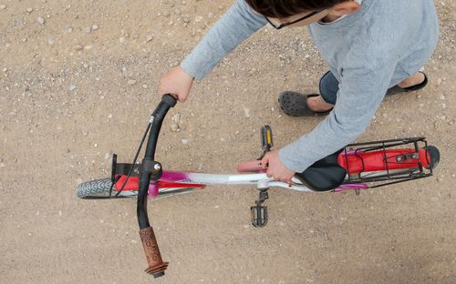 High angle view of boy playing on motorcycle