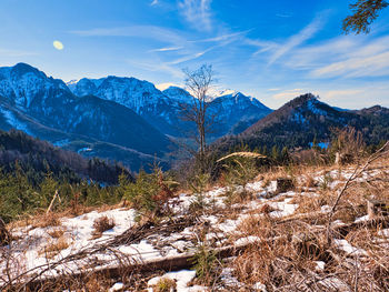 Scenic view of snowcapped mountains against sky