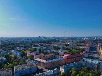 High angle view of townscape against blue sky