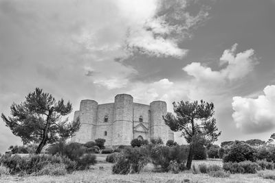 Old ruin on field against sky