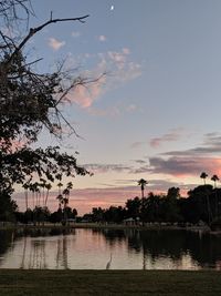 Scenic view of lake against sky during sunset