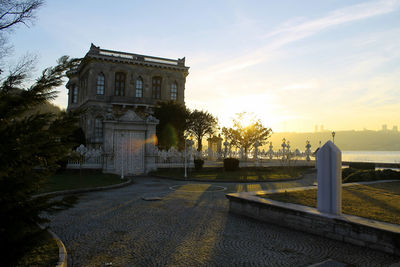 Built structure against sky at sunset