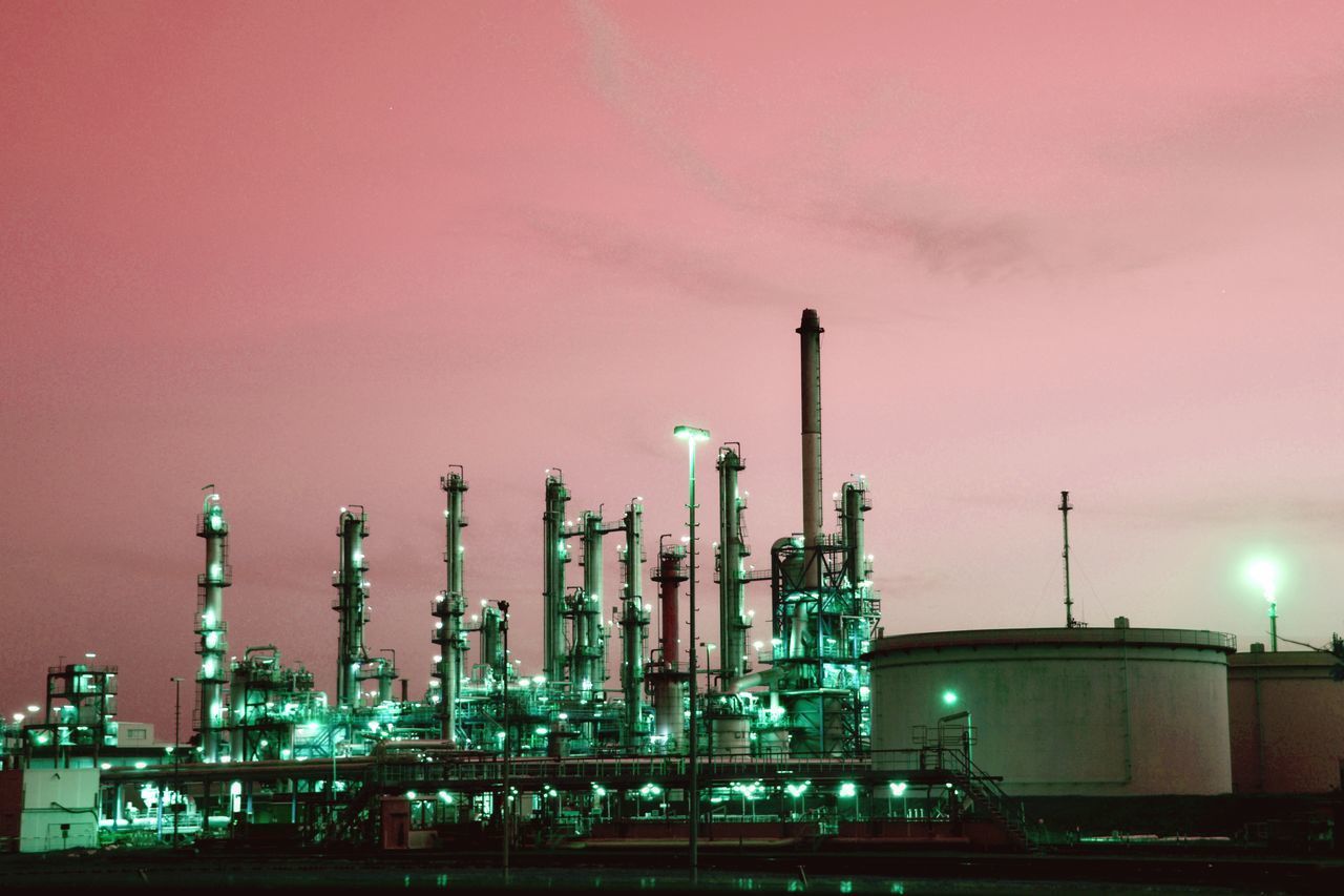 ILLUMINATED FACTORY AGAINST SKY AT NIGHT DURING FESTIVAL