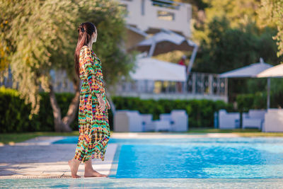 Woman standing in swimming pool