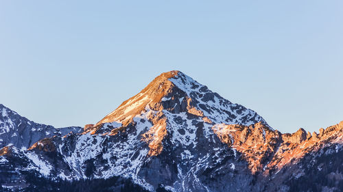 Scenic view of snowcapped mountains against clear sky