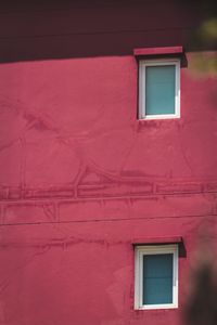 Low angle view of house window on building