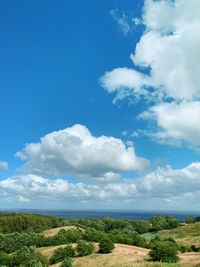 Scenic view of landscape against blue sky