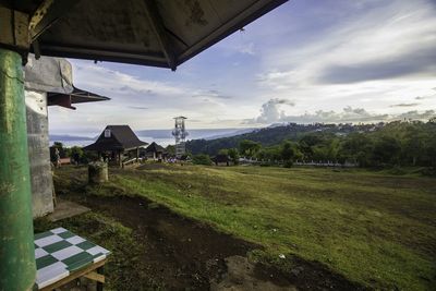 Scenic view of landscape against cloudy sky
