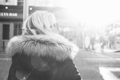 Rear view of a woman standing outdoors