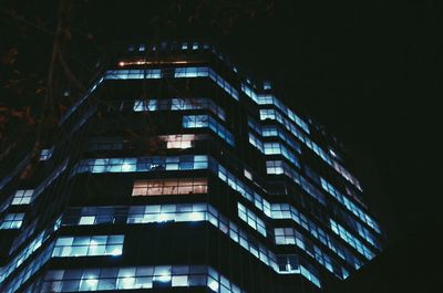 Low angle view of modern building at night