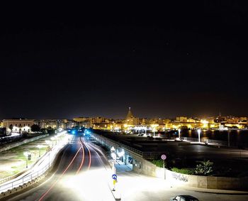 High angle view of light trails on road at night