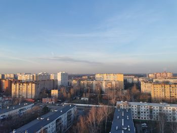 High angle view of buildings in city against sky