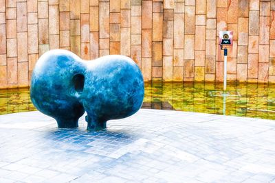 Statue against wall in city