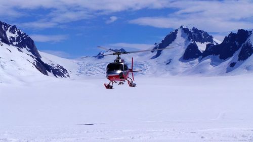 Helicopter on snow covered landscape