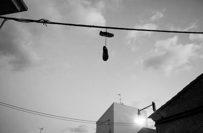 Low angle view of cables against sky