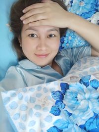 Close-up portrait of baby boy on bed