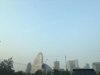 High section of skyscrapers against clear sky