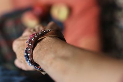 Close-up of arm wearing bracelet