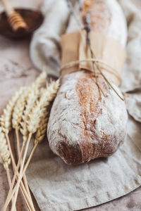 Loaf of artisan sourdough bread with lavender and honey with wheat ears. traditional artisan bread.