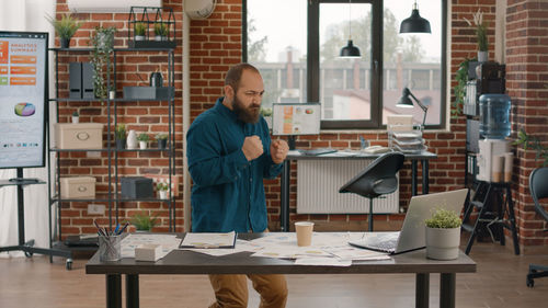 Cheerful man working in modern office