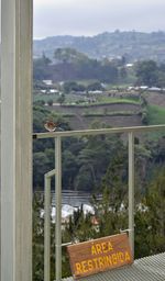 Scenic view of landscape seen through window