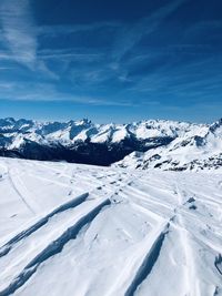 Scenic view of snowcapped mountains against sky