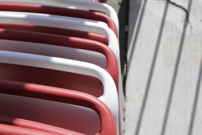 High angle view of metallic bench in row