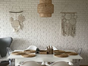 Table and chairs against wall at home