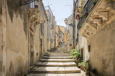 Narrow alley amidst buildings in city