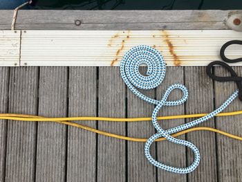 Directly above shot of ropes on boat deck
