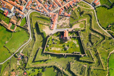 Mourao drone aerial top view of star shapped castle in alentejo, portugal