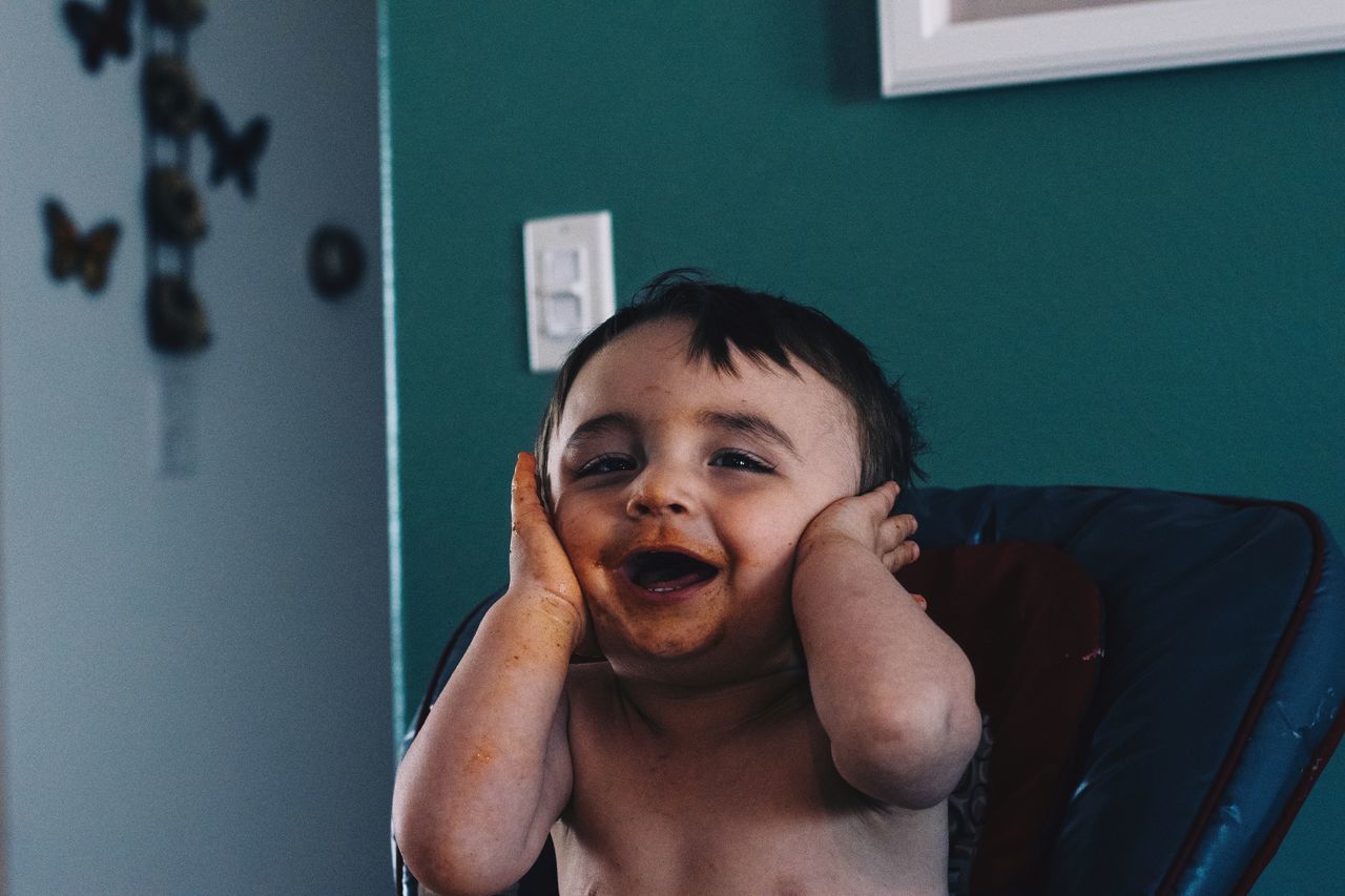 real people, childhood, child, indoors, portrait, shirtless, front view, one person, men, innocence, males, headshot, lifestyles, boys, looking at camera, cute, emotion, mouth open, making a face