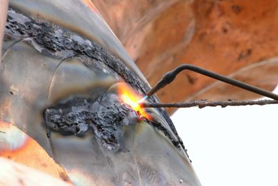 Welding at bronze statue