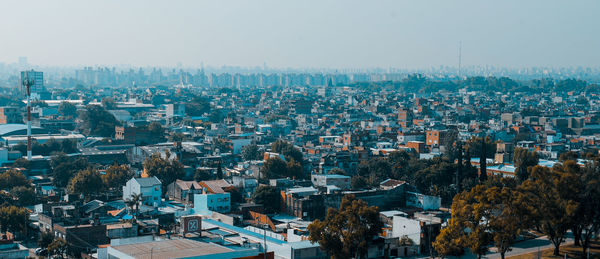 High angle view of buildings in city against sky