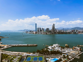 View of city by sea against sky