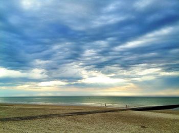 Scenic view of sea against cloudy sky