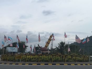 Scenic view of flags against sky