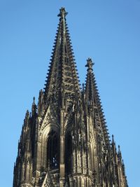 Low angle view of temple against clear blue sky