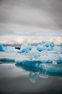 Scenic view of glacier against sky