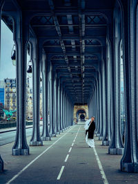 Rear view of people walking in city