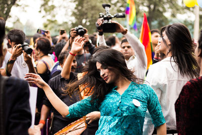 Group of people dancing at music concert