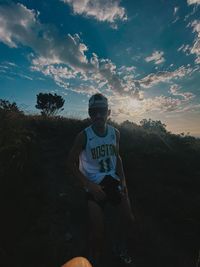 Low section of man against sky